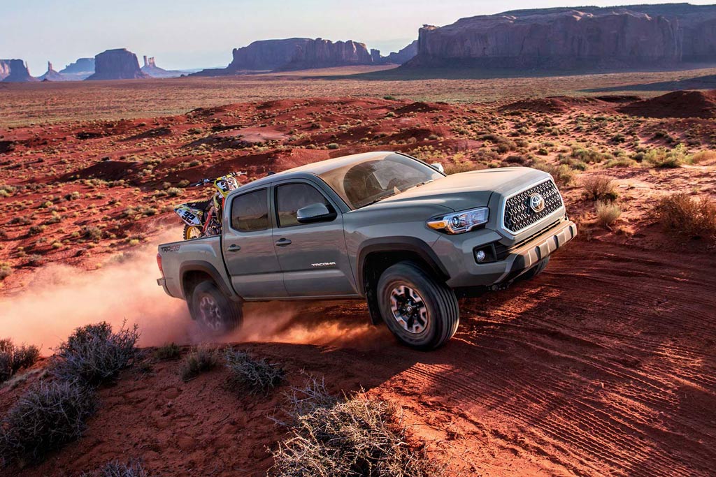 Toyota truck carrying dirt bike